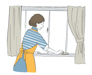窓掃除をする女性
