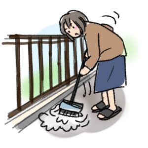 ベランダ掃除をする女性