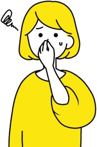 鼻をつまむ女性